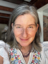 Load image into Gallery viewer, Founder of LUX Lifestyle with glowing, hydrated skin after applying Tulsi botanical face oil.